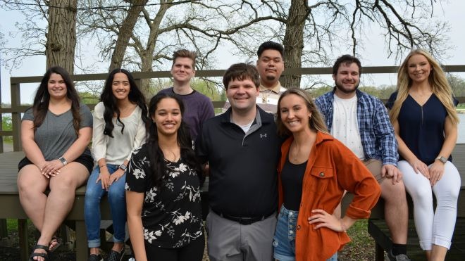 Nine students from the Student Physical Therapist Assistants Club outside